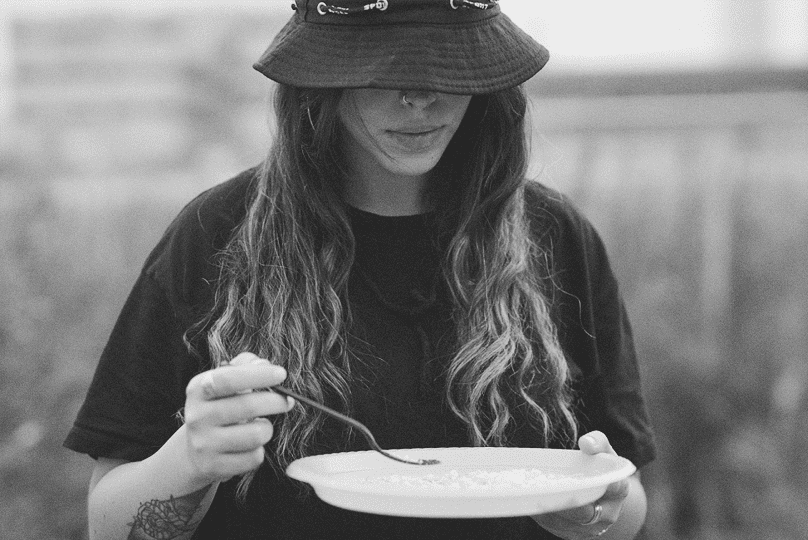 Girl eating at Woodstock 2021
